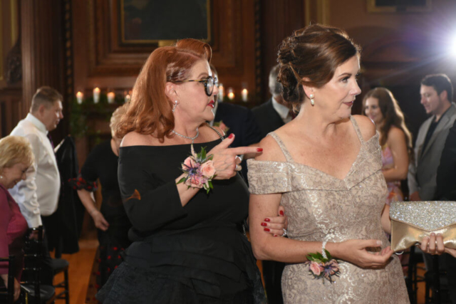 Mothers of the Bride and Groom with floral wrist corsages
